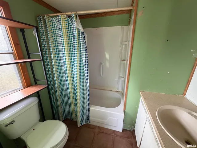 a bathroom with sink toilet and tub