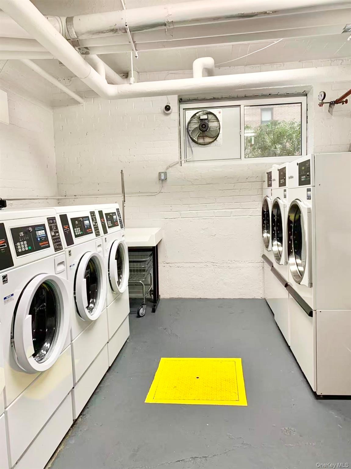 43-35 Union Street, Unit 2G Queens, NY 11355 - Photo 14 of 15 a utility room with dryer and washer