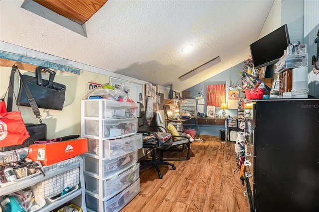 a view of a living room with a flat screen tv and a couch