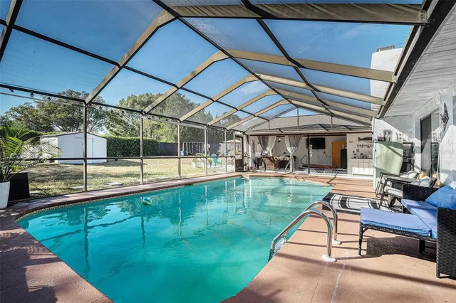 a view of swimming pool with a patio