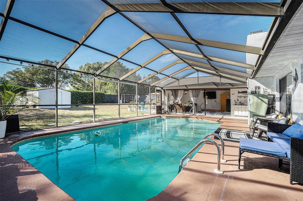8212 Delaware Drive Weeki Wachee, FL 34607 - Photo 2 of 33 a view of swimming pool with a patio