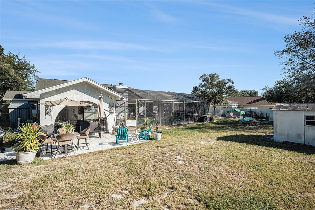 8212 Delaware Drive Weeki Wachee, FL 34607 - Photo 26 of 33 a view of a house with a yard
