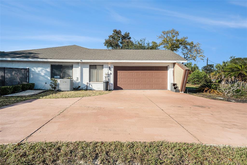 8212 Delaware Drive Weeki Wachee, FL 34607 - Photo 27 of 33 a view of a house with a yard and potted plants