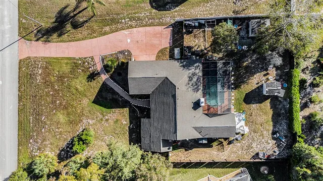 aerial view of a house with backyard