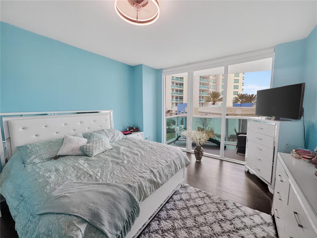 231 Riverside Drive, Unit 2081 Holly Hill, FL 32117 - Photo 12 of 38 a bedroom with a bed and furniture