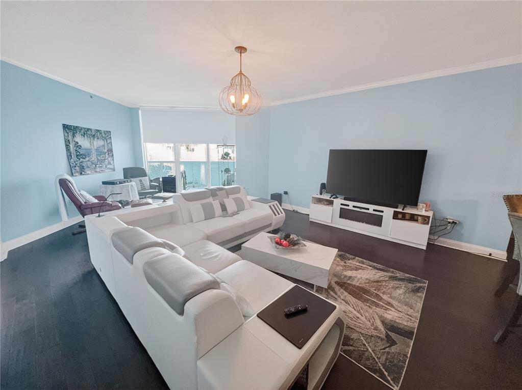 231 Riverside Drive, Unit 2081 Holly Hill, FL 32117 - Photo 14 of 38 a living room with furniture and a flat screen tv