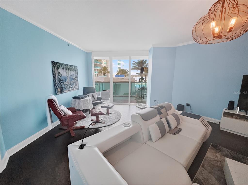 231 Riverside Drive, Unit 2081 Holly Hill, FL 32117 - Photo 15 of 38 a living room with furniture and a large window