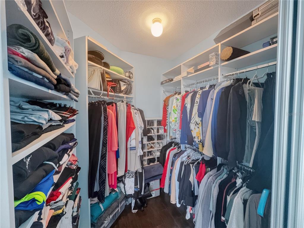 231 Riverside Drive, Unit 2081 Holly Hill, FL 32117 - Photo 16 of 38 a view of walk in closet with clothes and shoes