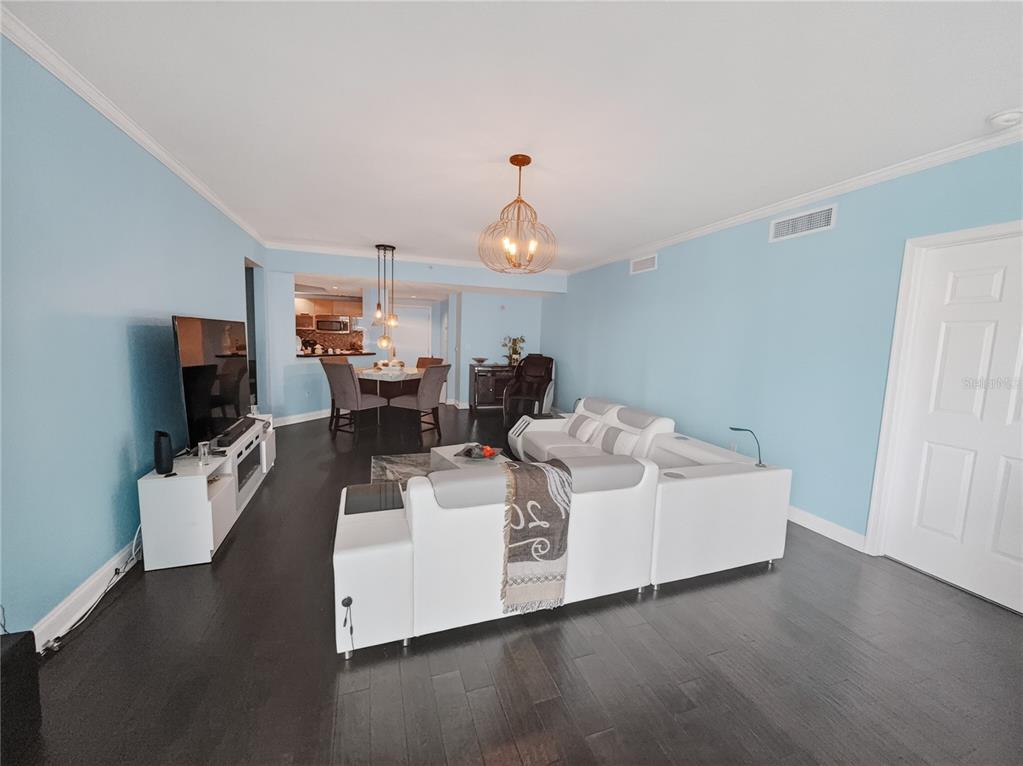 231 Riverside Drive, Unit 2081 Holly Hill, FL 32117 - Photo 18 of 38 a living room with furniture a flat screen tv and a fireplace