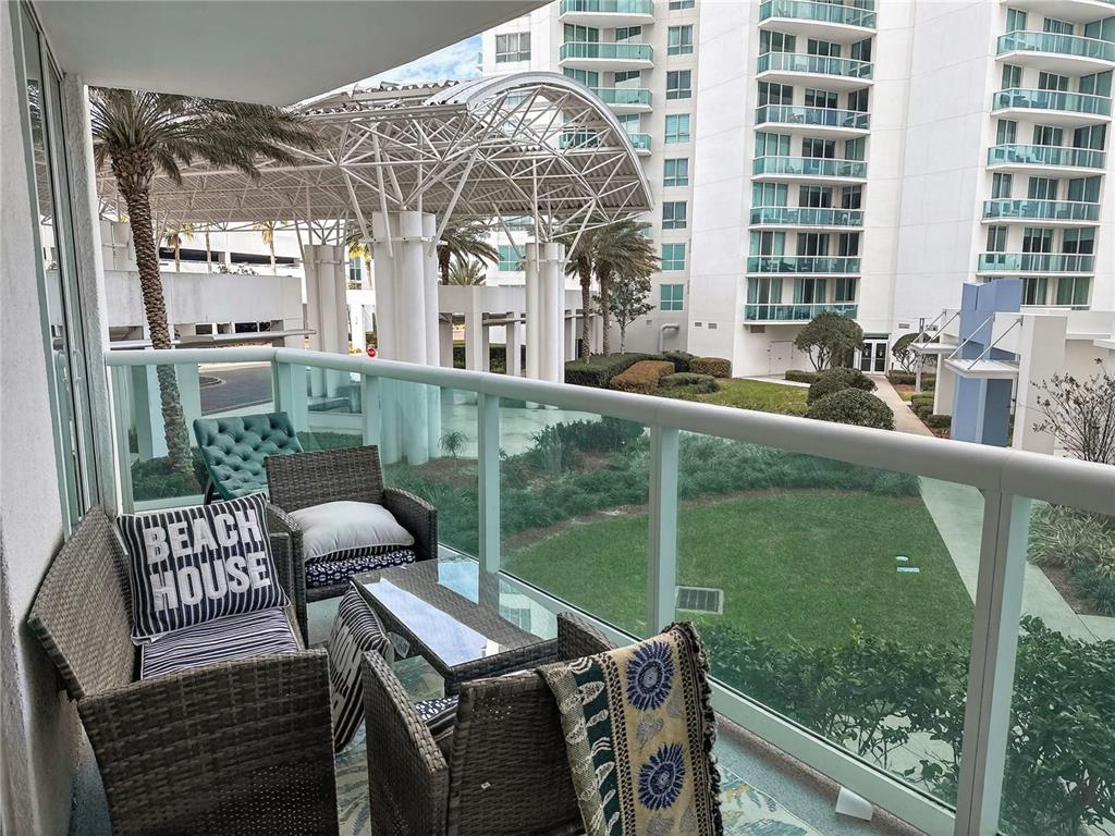 231 Riverside Drive, Unit 2081 Holly Hill, FL 32117 - Photo 2 of 38 a view of a balcony with two chairs and a table