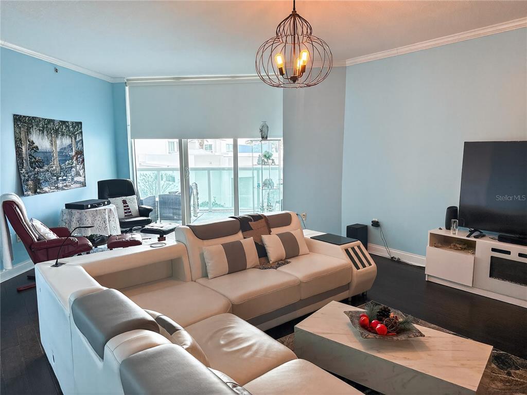 231 Riverside Drive, Unit 2081 Holly Hill, FL 32117 - Photo 5 of 38 a living room with furniture and a flat screen tv