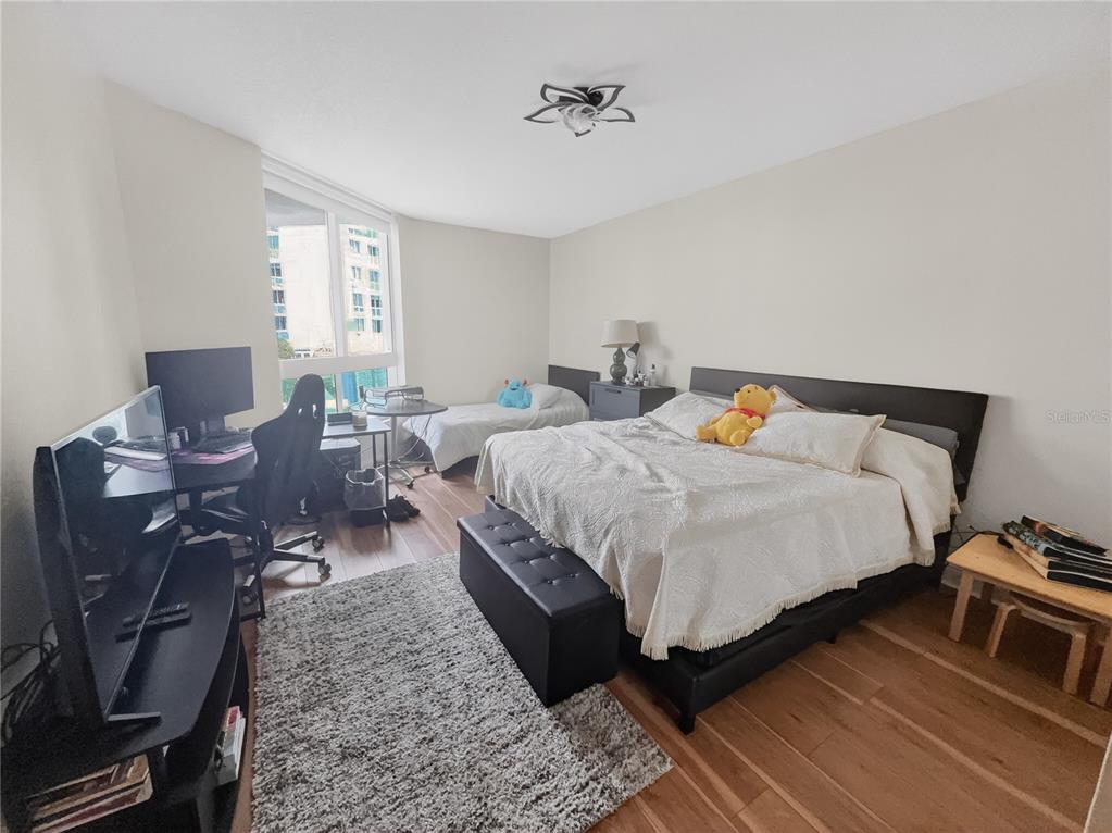 231 Riverside Drive, Unit 2081 Holly Hill, FL 32117 - Photo 6 of 38 a bedroom with a bed chair and window