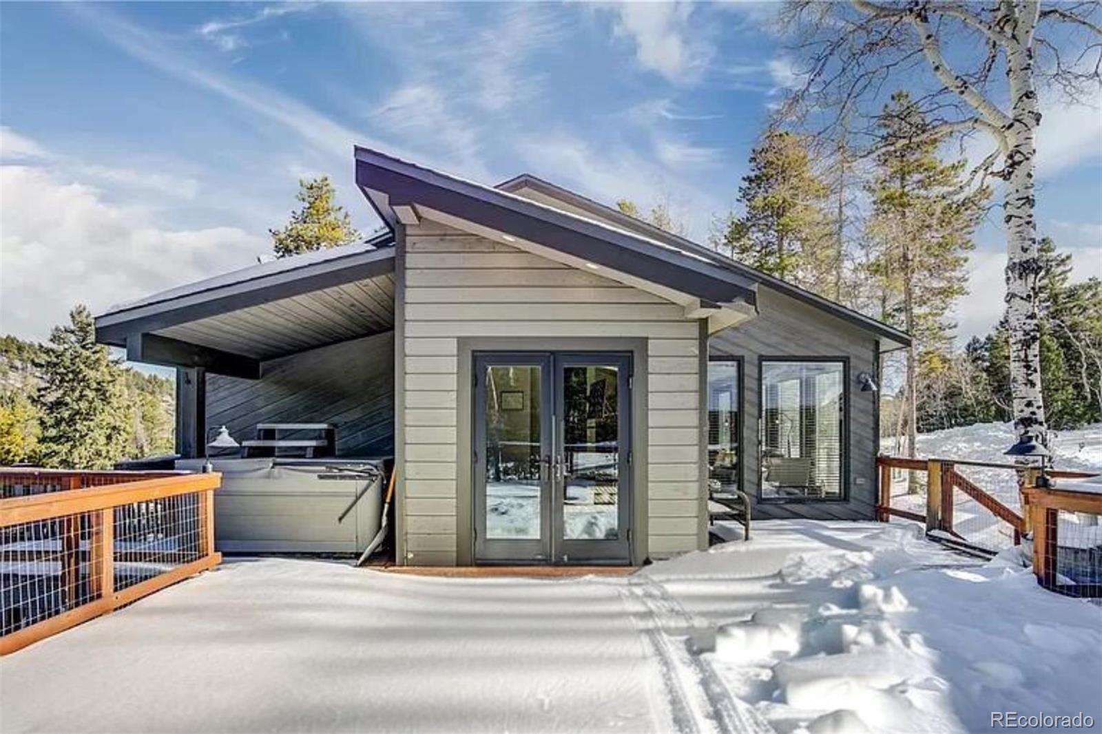 a view of a porch with furniture and a garage