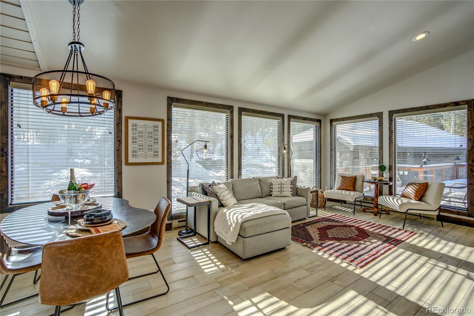 19273 Silver Ranch Road Conifer, CO 80433 - Photo 13 of 37 a living room with furniture and floor to ceiling windows