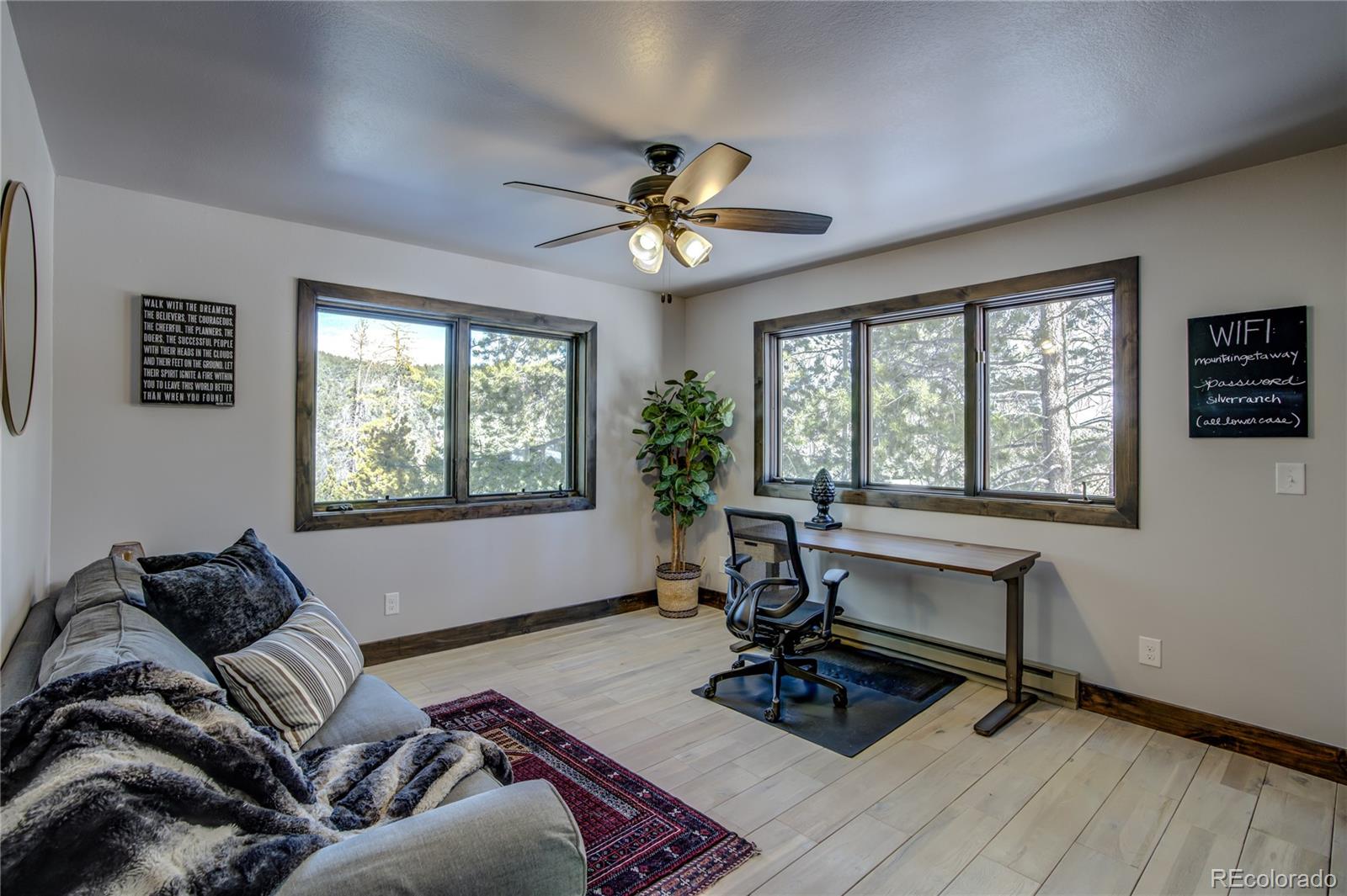 19273 Silver Ranch Road Conifer, CO 80433 - Photo 25 of 37 a living room with furniture and a window