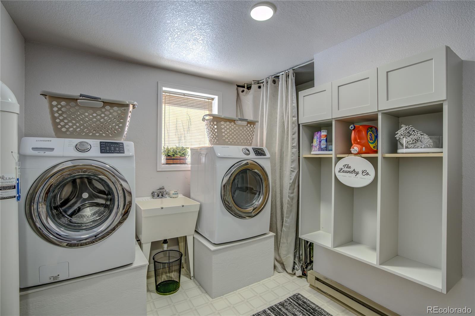 19273 Silver Ranch Road Conifer, CO 80433 - Photo 28 of 37 a utility room with sink dryer and washer
