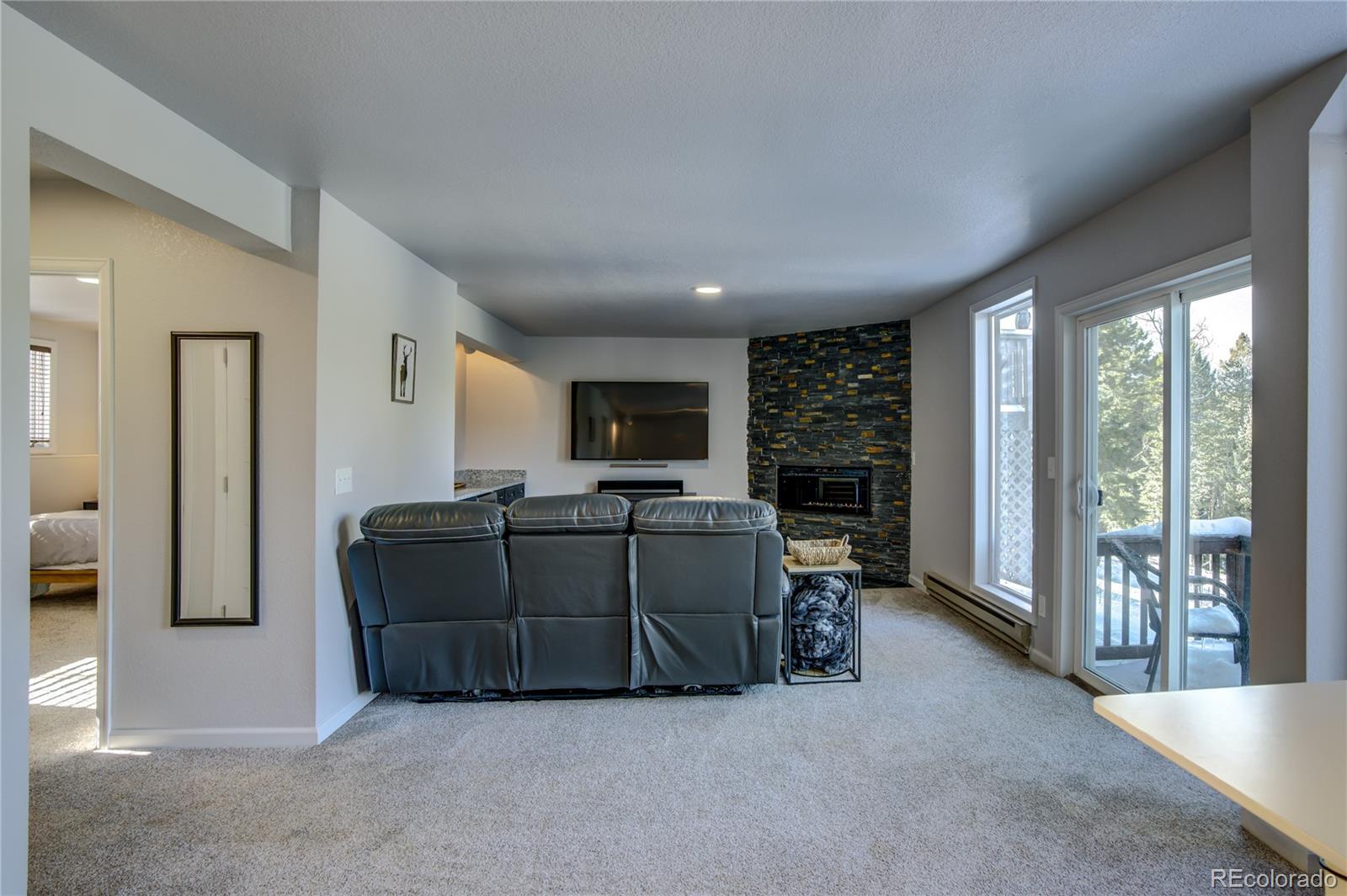 19273 Silver Ranch Road Conifer, CO 80433 - Photo 30 of 37 a living room with furniture