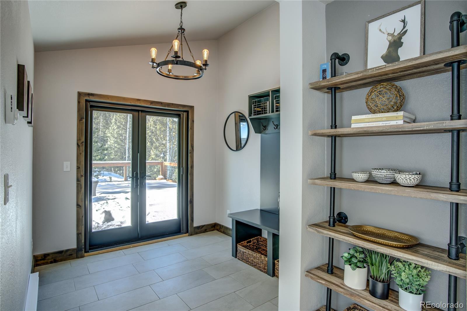 19273 Silver Ranch Road Conifer, CO 80433 - Photo 9 of 37 a view of entryway with dining room