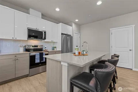 a bedroom with a bed and a lamp