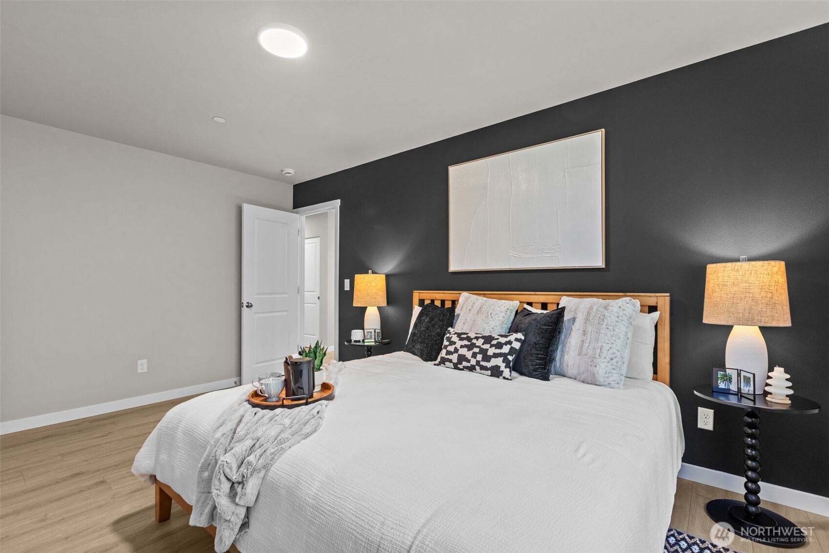 114 A 169th Place Southwest Bothell, WA 98012 - Photo 19 of 31 a bedroom with a bed and a lamp