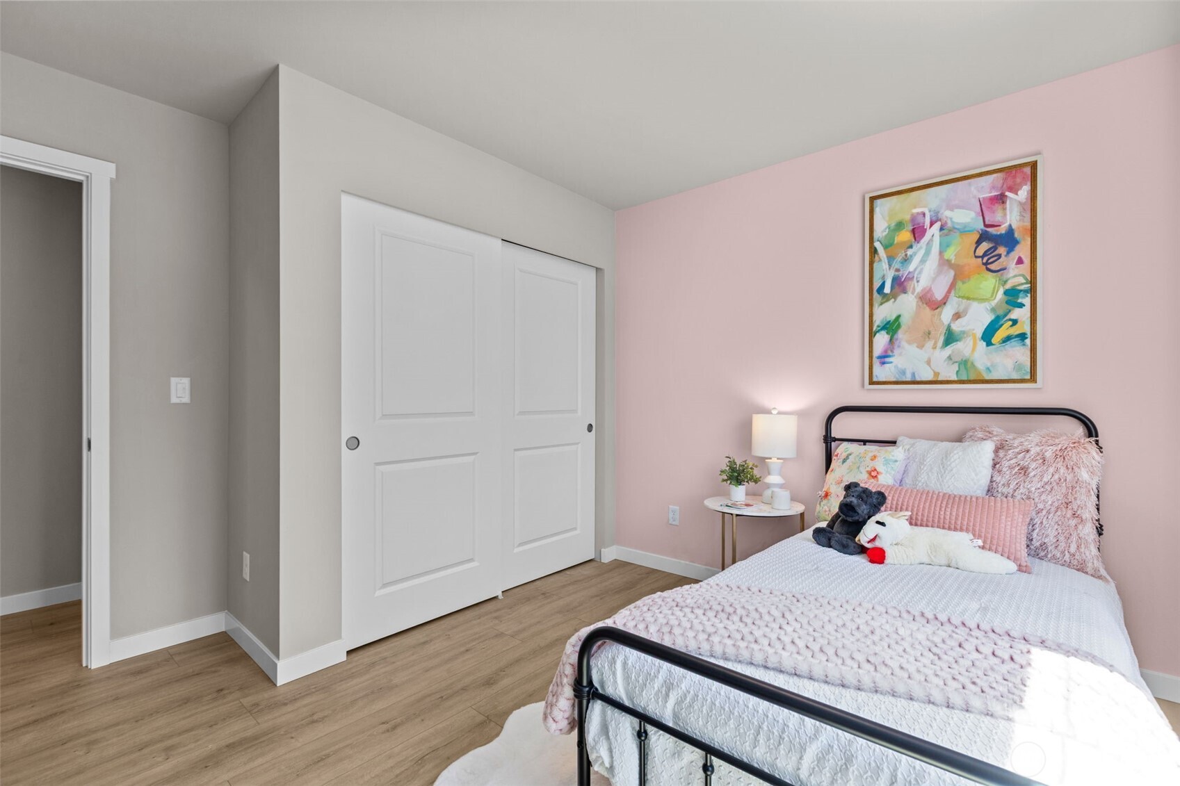 114 A 169th Place Southwest Bothell, WA 98012 - Photo 25 of 31 a bedroom with a bed and wooden floor