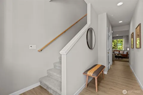 a view of a room with a bed and a chair