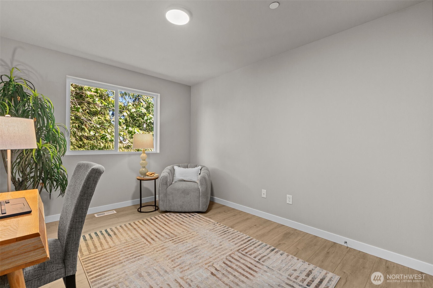 114 A 169th Place Southwest Bothell, WA 98012 - Photo 28 of 31 a view of a room with a bed and a chair