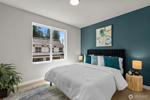 a bedroom with bed and cupboard