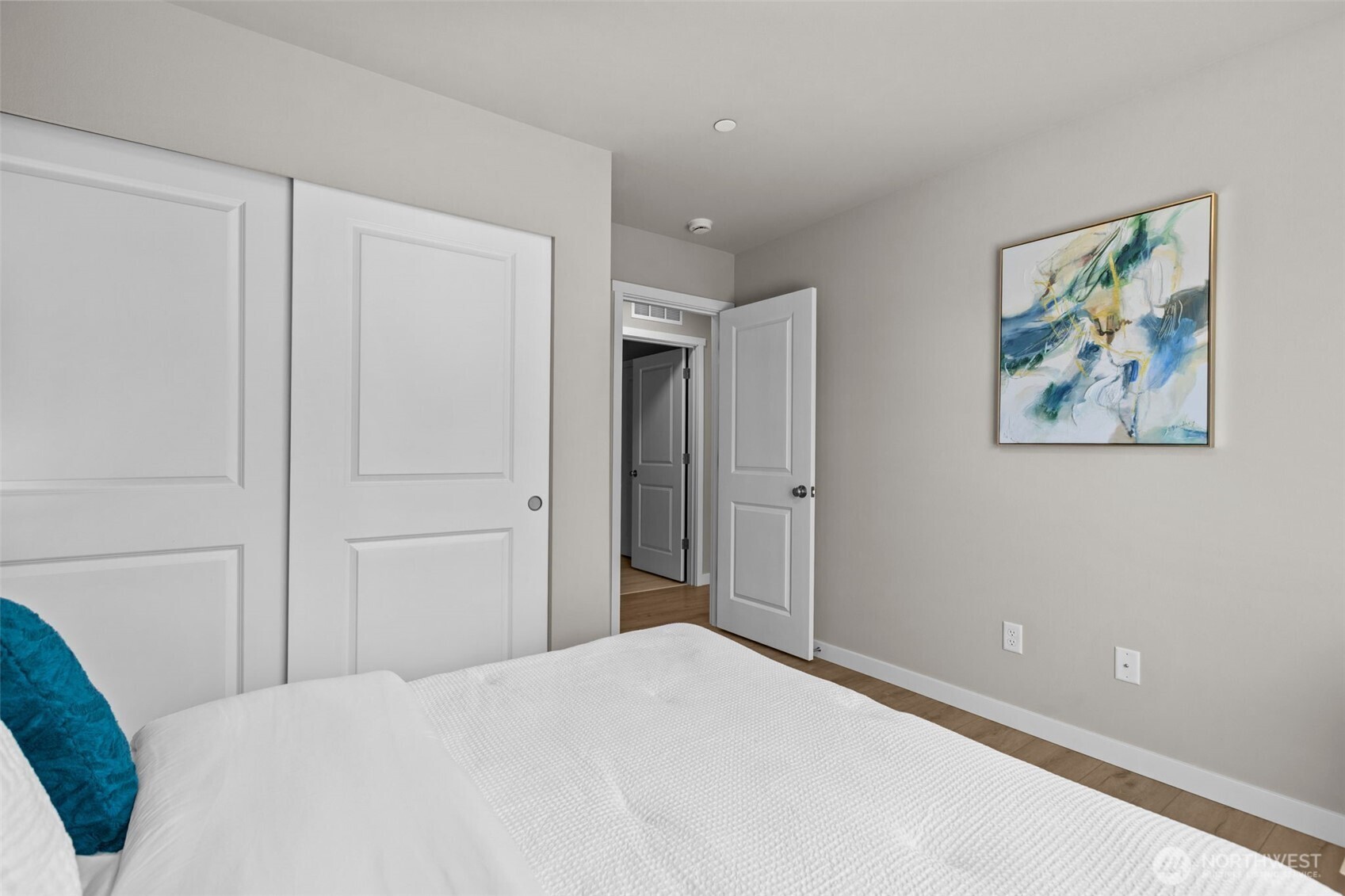 114 A 169th Place Southwest Bothell, WA 98012 - Photo 31 of 31 a bedroom with a bed and painting on the wall