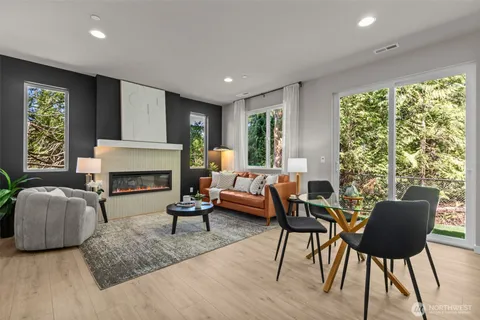 a kitchen with stainless steel appliances white cabinets and a stove top oven