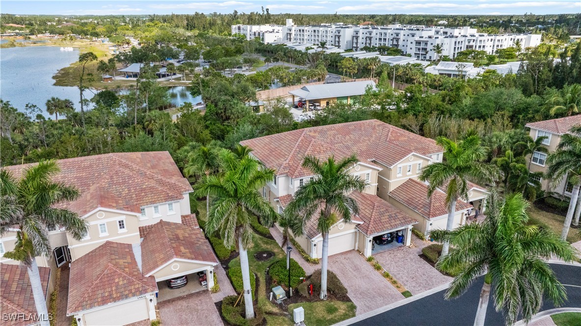 14941 Reflection Key Circle, Unit 621 Fort Myers, FL 33907 - Photo 1 of 42 an aerial view of residential houses with outdoor space