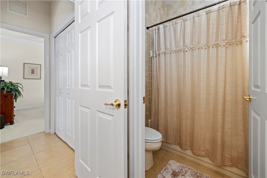 14941 Reflection Key Circle, Unit 621 Fort Myers, FL 33907 - Photo 11 of 42 a bathroom with a toilet a sink and tub