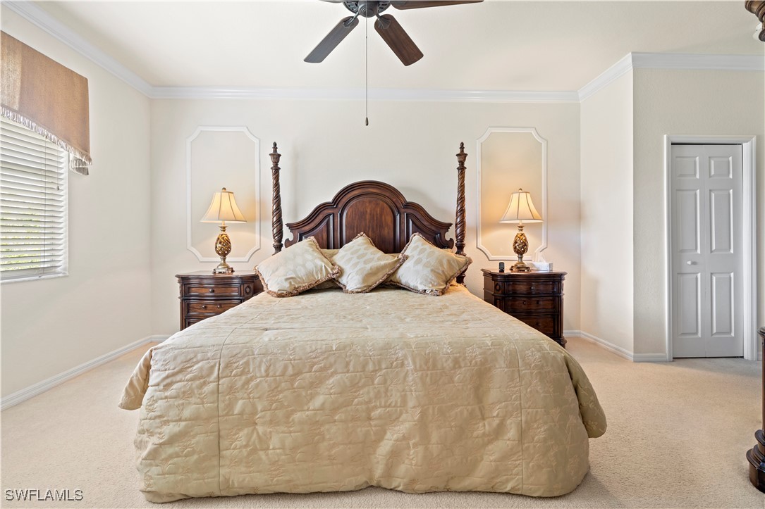 14941 Reflection Key Circle, Unit 621 Fort Myers, FL 33907 - Photo 18 of 42 a large bed sitting in a bedroom next to a window and a chandelier