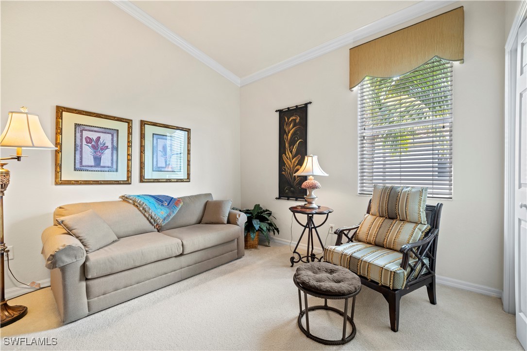 14941 Reflection Key Circle, Unit 621 Fort Myers, FL 33907 - Photo 22 of 42 a living room with furniture a couch and two windows