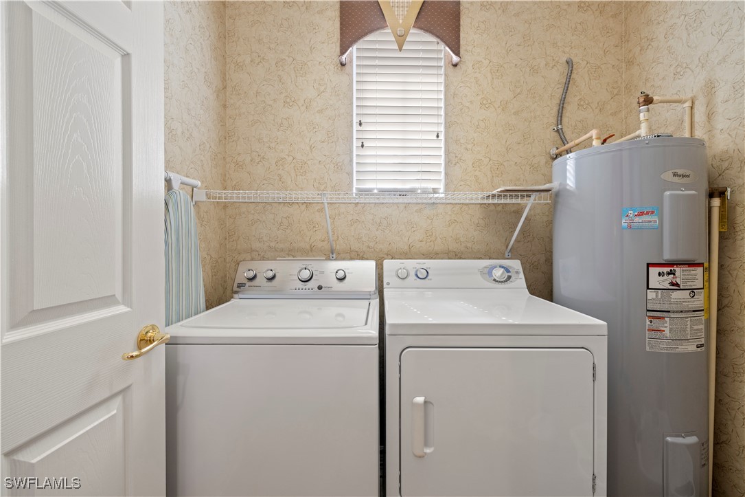 14941 Reflection Key Circle, Unit 621 Fort Myers, FL 33907 - Photo 25 of 42 a utility room with dryer and washer