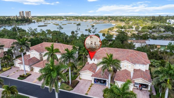 14941 Reflection Key Circle, Unit 621 Fort Myers, FL 33907 - Photo 3 of 42 an aerial view of residential houses with outdoor space and lake view in back