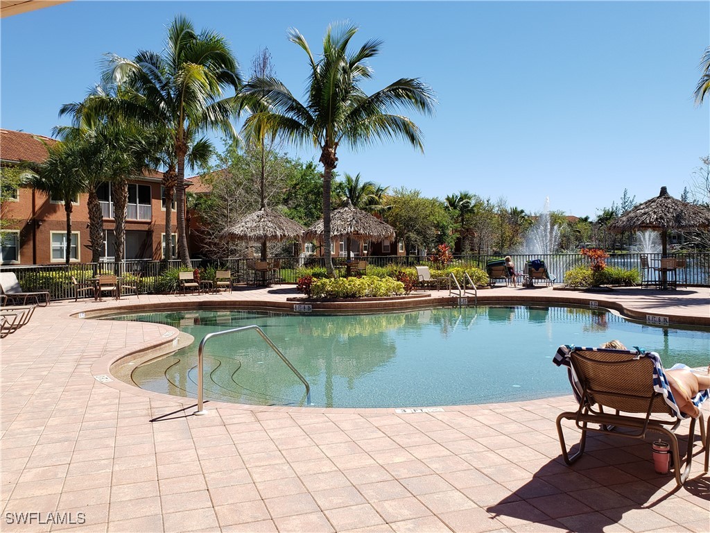 14941 Reflection Key Circle, Unit 621 Fort Myers, FL 33907 - Photo 36 of 42 a view of swimming pool with chairs