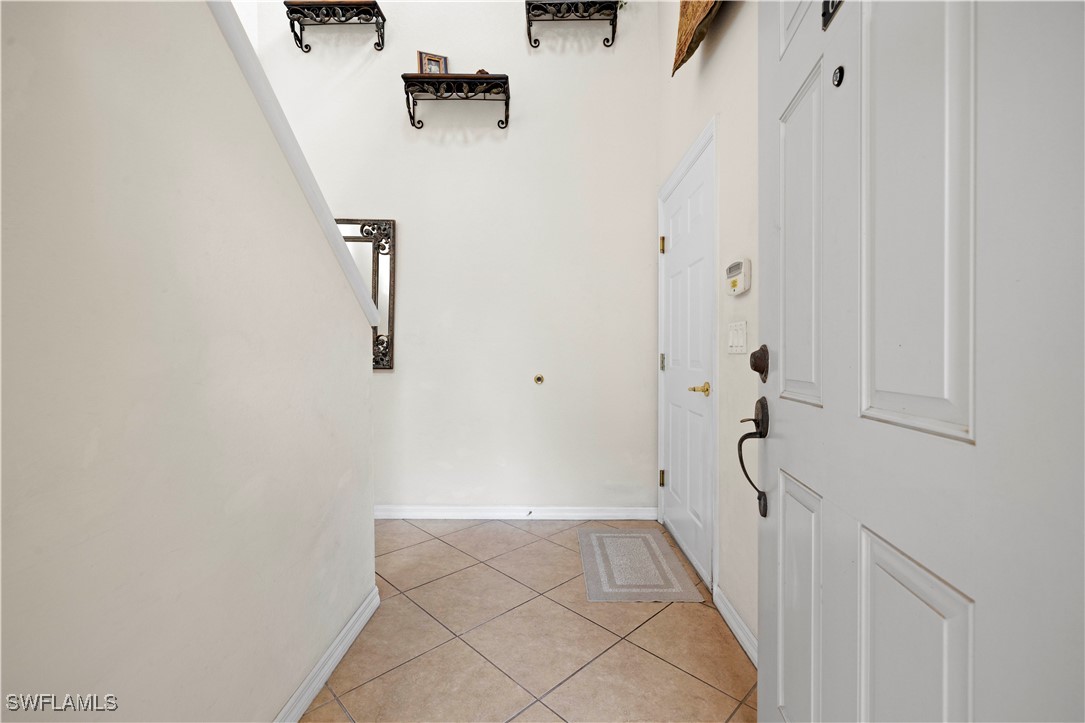 14941 Reflection Key Circle, Unit 621 Fort Myers, FL 33907 - Photo 4 of 42 a view of a hallway with closet
