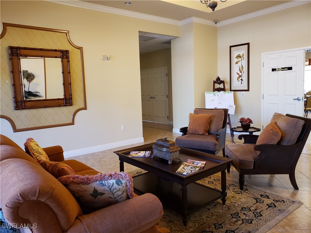 14941 Reflection Key Circle, Unit 621 Fort Myers, FL 33907 - Photo 41 of 42 a living room with furniture and a window