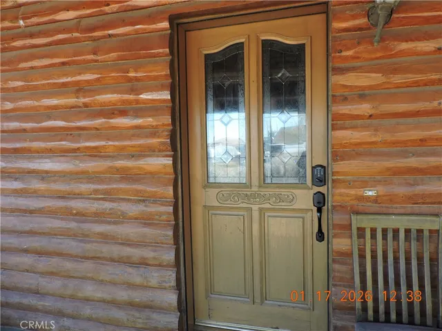 an aerial view of residential house and sandy dunes