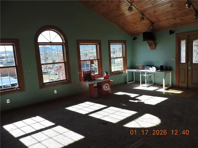 a bathroom with a shower and a toilet