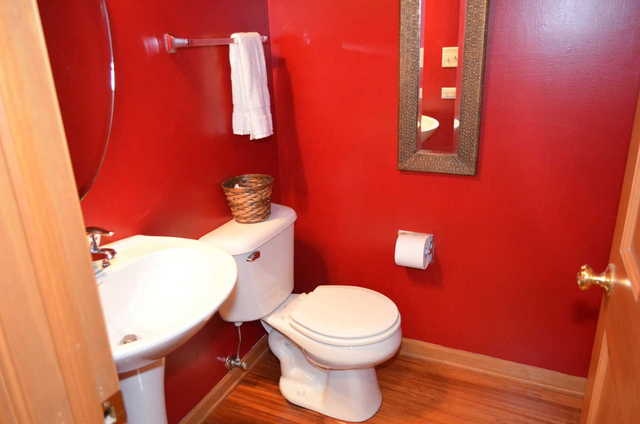 2548 Congress Avenue Aurora, IL 60503 - Photo 15 of 22 a white toilet sitting next to a sink