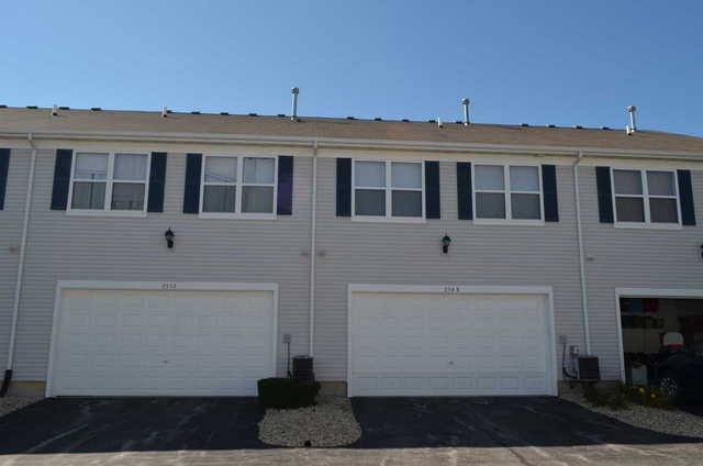 2548 Congress Avenue Aurora, IL 60503 - Photo 20 of 22 a front view of a building with a yard