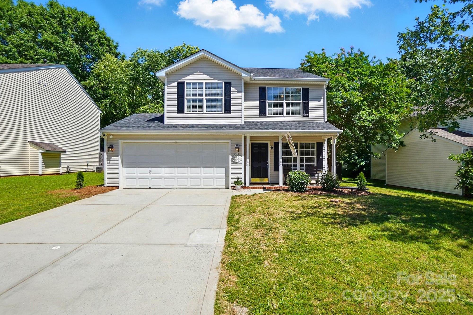 820 Settlement Street Clover, SC 29710 - Photo 1 of 29 a front view of a house with a yard and garage