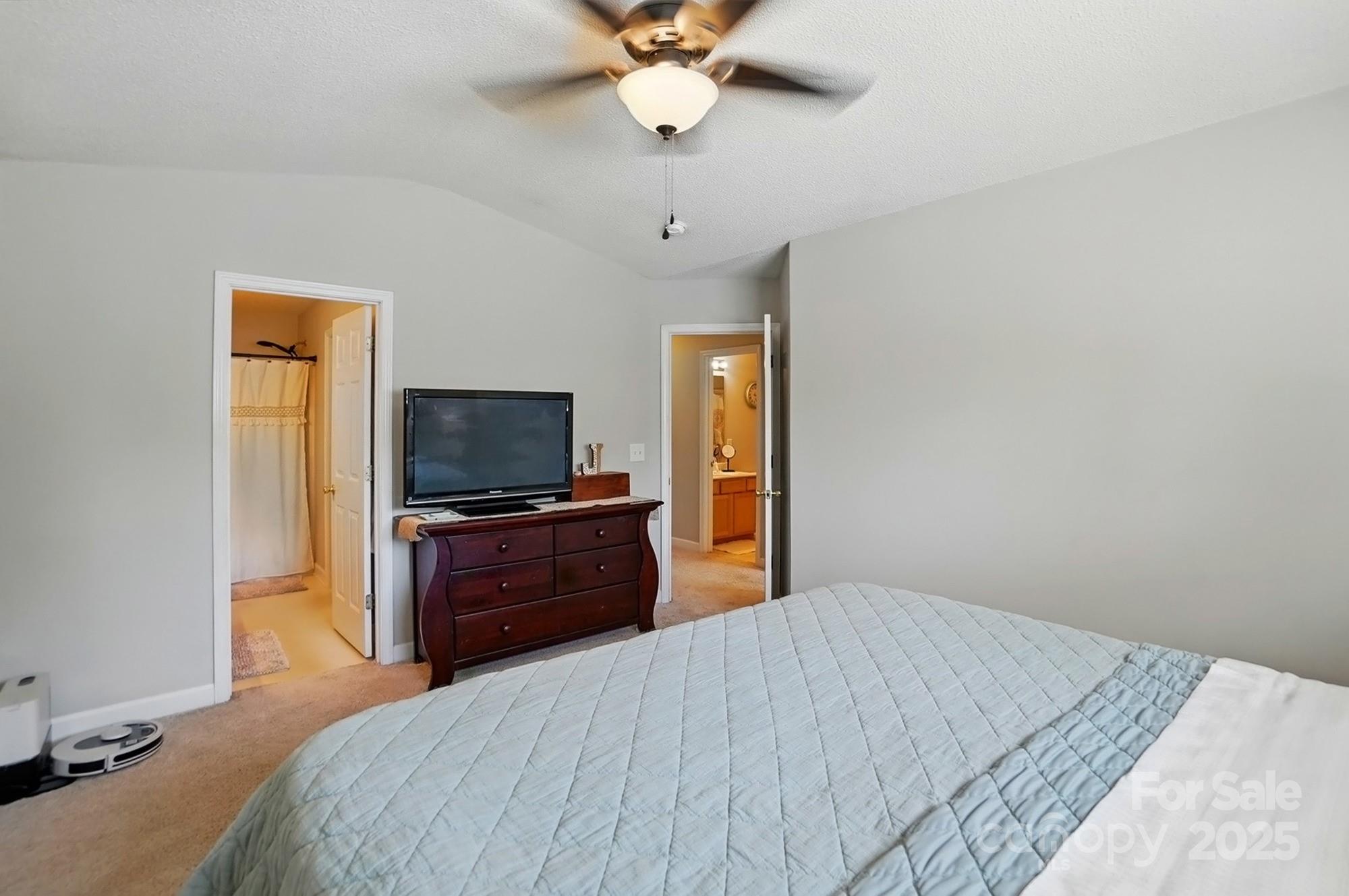 820 Settlement Street Clover, SC 29710 - Photo 15 of 29 a bedroom with a bed and a flat screen tv