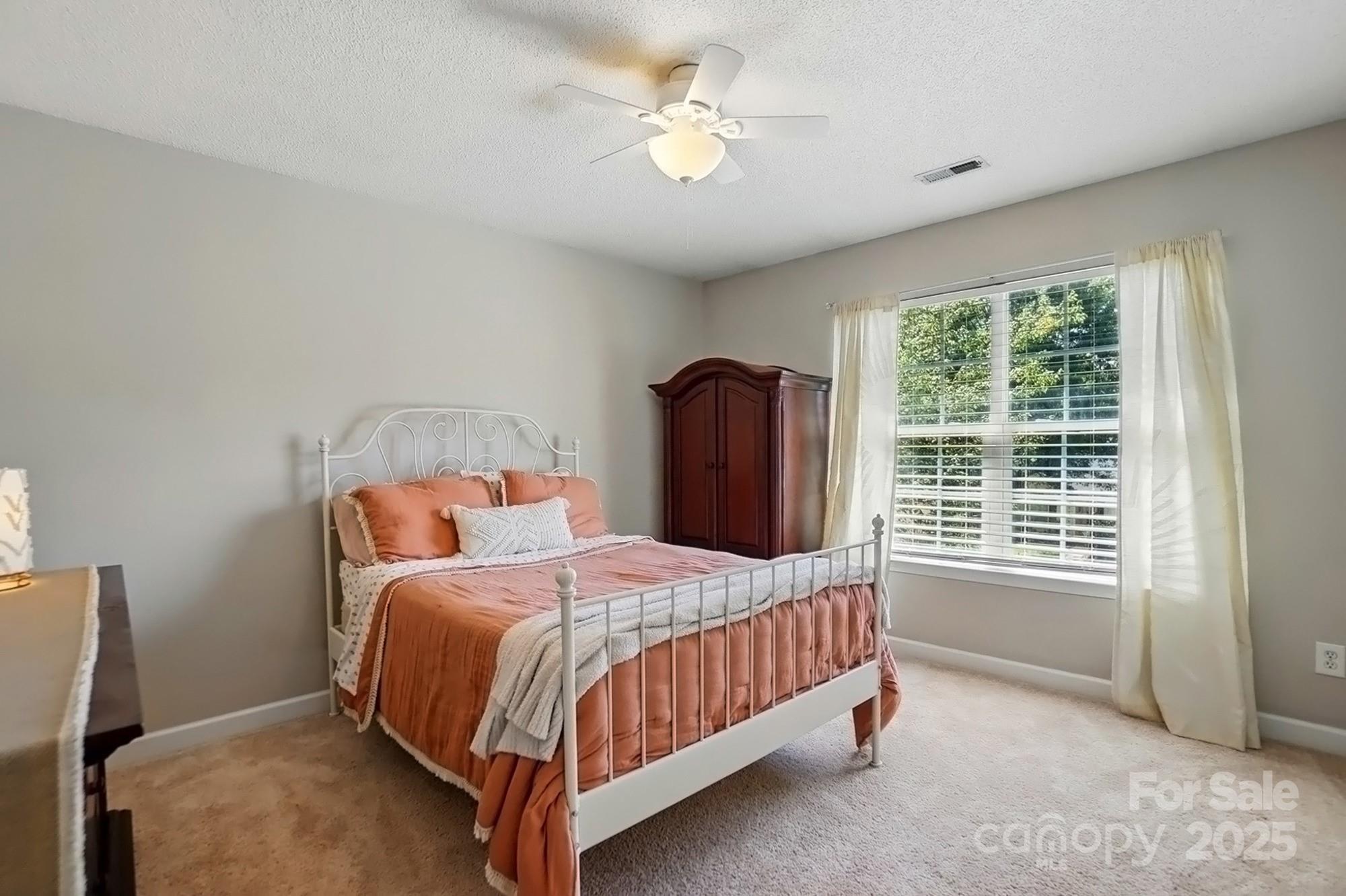820 Settlement Street Clover, SC 29710 - Photo 18 of 29 a bedroom with a bed and a window