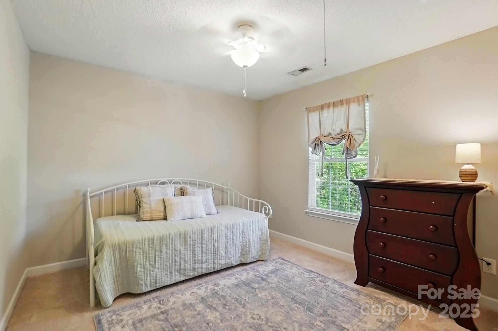 820 Settlement Street Clover, SC 29710 - Photo 22 of 29 a bedroom with a bed and a window