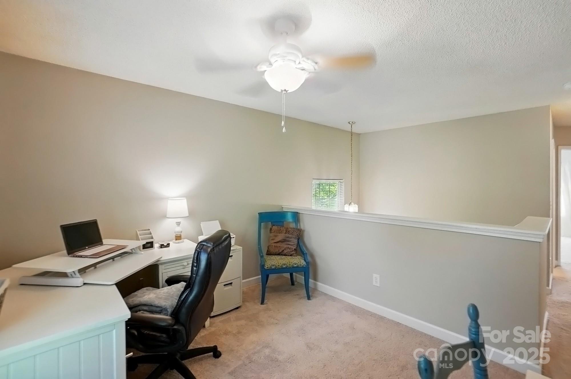 820 Settlement Street Clover, SC 29710 - Photo 26 of 29 a view of a workspace with furniture and a window