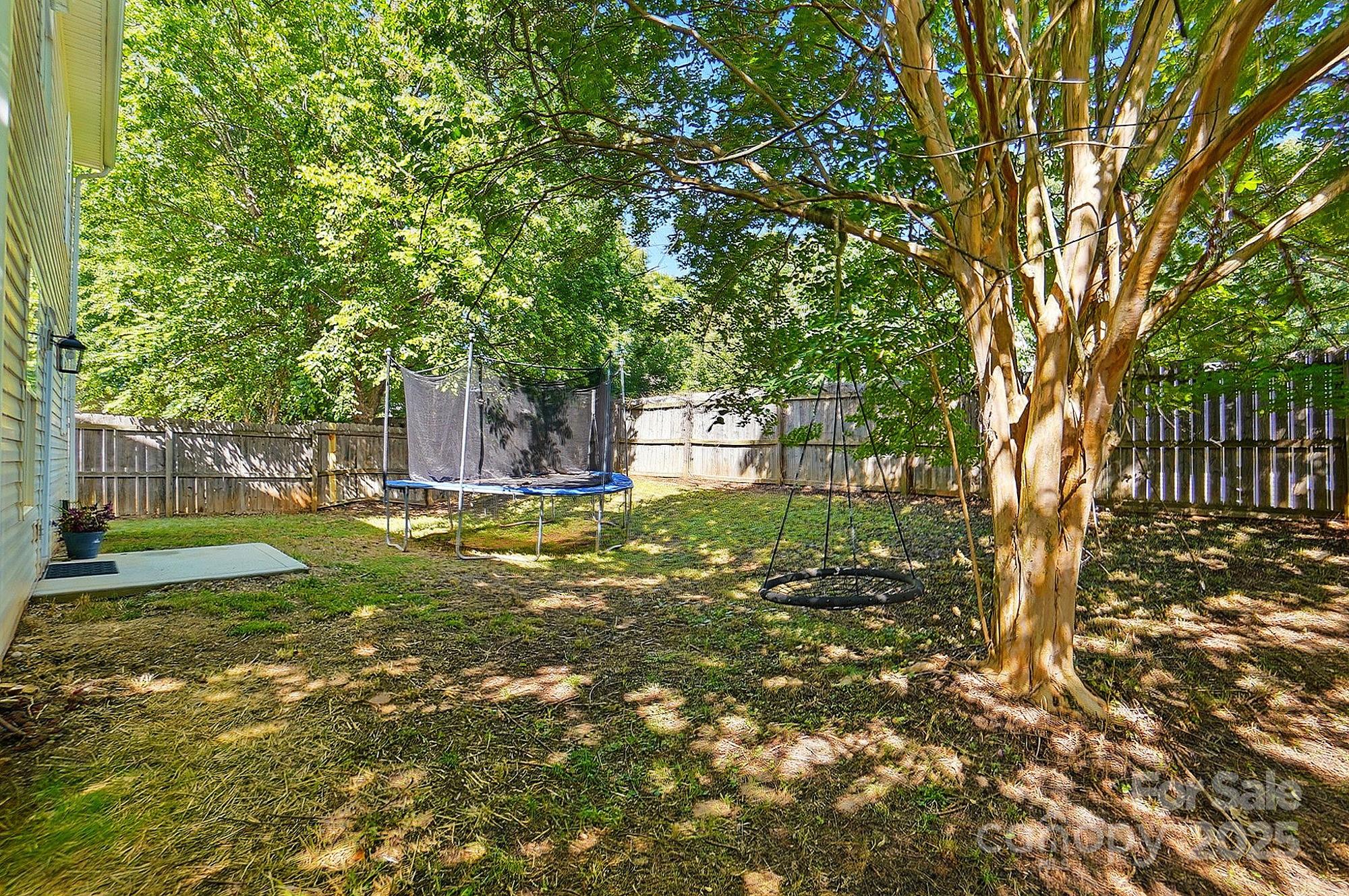 820 Settlement Street Clover, SC 29710 - Photo 28 of 29 a backyard of a house with lots of green space