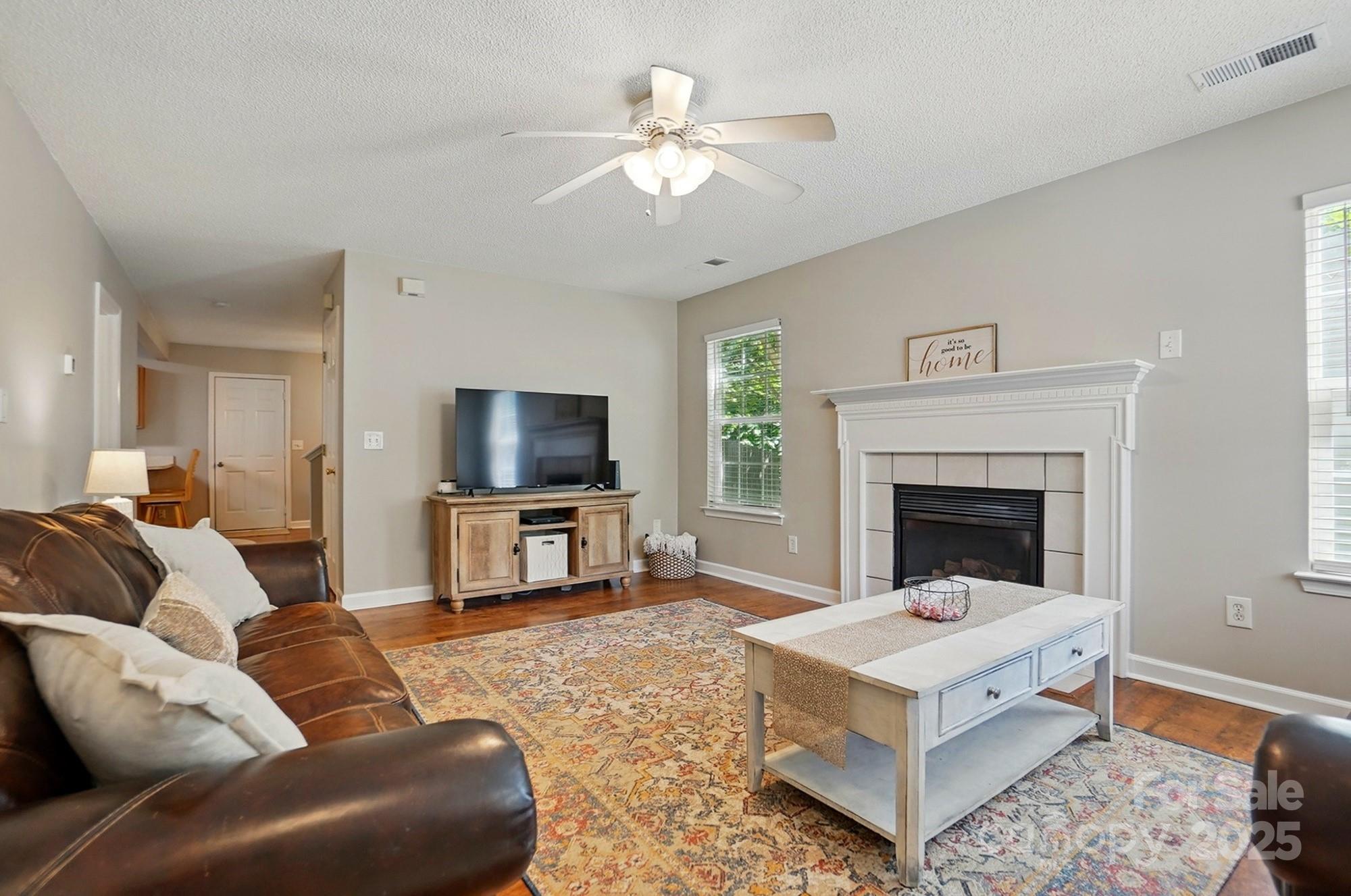 820 Settlement Street Clover, SC 29710 - Photo 3 of 29 a living room with furniture and a fireplace